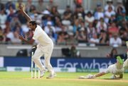 India bowler Ravi Ashwin celebrates as England batsman Joe Root is run out by a direct throw from Virat Kohli